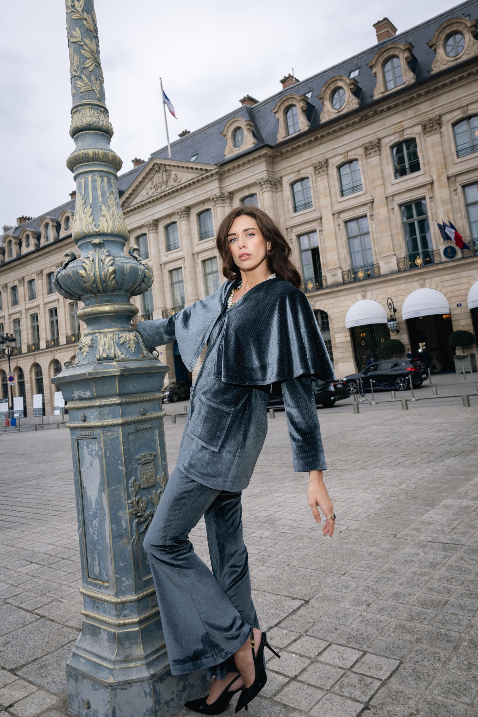 Woman in a velvet silver grey suit dancing. Party outfit. Ramadan outfit.