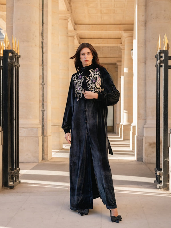 Introducing the Notte Kimono — a limited-edition velvet piece hand-embroidered to couture standards.Produced in fewer than 50 pieces, it pairs architectural structure with a fluid, elongated drape — refined enough for formal evenings, powerful enough for elevated events, and effortless for sophisticated everyday wear.Rooted in Middle Eastern evening dressing and shaped through a modern, minimalist lens, the Notte Kimono embodies craftsmanship, precision, and quiet confidence.Designed for women who seek modest luxury, exclusive eveningwear, and true artisan work.